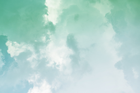 White cloud and green sky background with copy spaceの写真素材