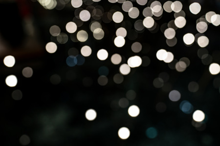 White bokeh background of Christmas lights and New yearの写真素材