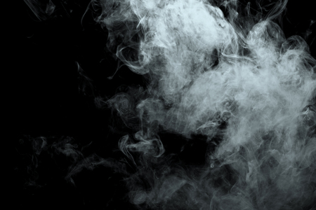 Abstract powder or smoke effect isolated on black backgroundの写真素材