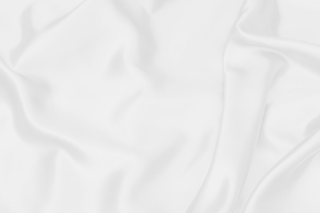 white satin fabric texture soft blur backgroundの写真素材
