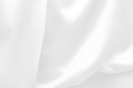 white satin fabric texture soft blur backgroundの写真素材