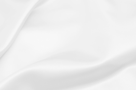 white satin fabric texture soft blur backgroundの写真素材