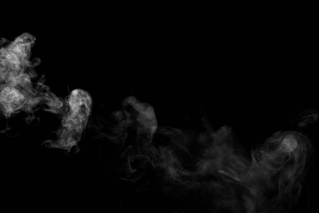 Abstract powder or smoke isolated on black backgroundの写真素材