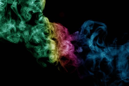 Abstract smoke isolated on black background,Rainbow powderの写真素材