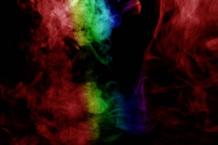 Abstract smoke isolated on black background,Rainbow powderの写真素材