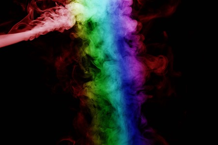 Abstract smoke isolated on black background,Rainbow powderの写真素材