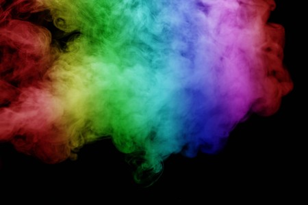 Abstract smoke isolated on black background,Rainbow powderの写真素材