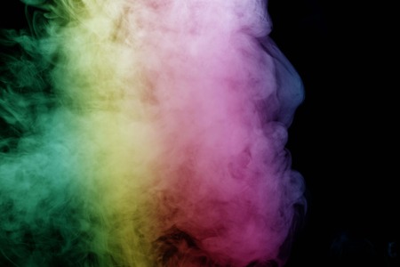 Abstract smoke isolated on black background,Rainbow powderの写真素材