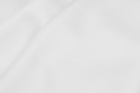 white satin fabric texture soft blur backgroundの写真素材
