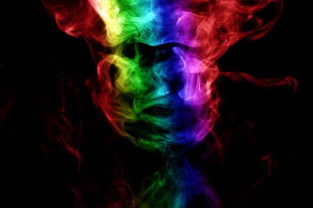 Abstract smoke isolated on black background,Rainbow powderの写真素材