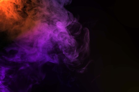 Abstract smoke isolated on black background,Rainbow powderの写真素材