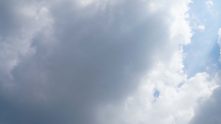 White cloud and blue sky background with copy space