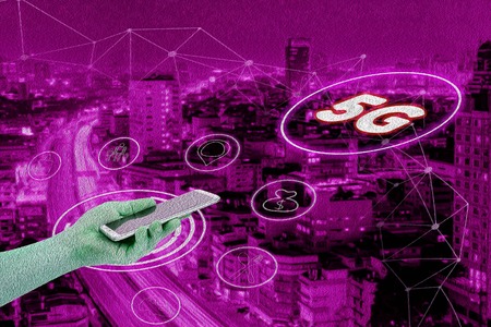 Abstract pink oil paint with 5G network interface and icon concept,hand holding mobile smart phone with cityscape textured backgroundの写真素材