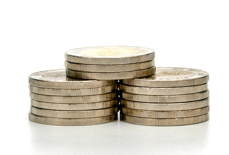 closeup silver coins stacks isolated on white background