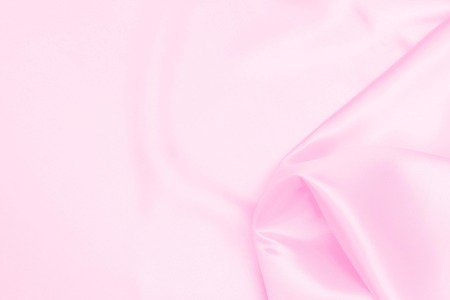 Plastic pink satin fabric texture soft blur backgroundの写真素材