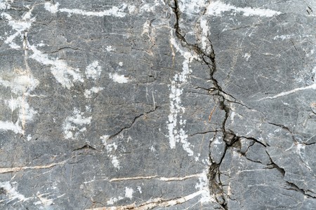Closeup rock pattern with hole in nature