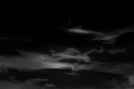 white cloud and black sky textured backgroundの写真素材