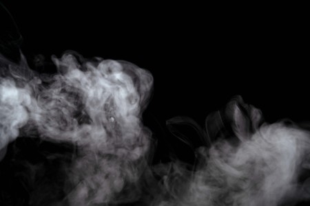 Abstract powder or smoke effect isolated on black background,Out of focusの写真素材