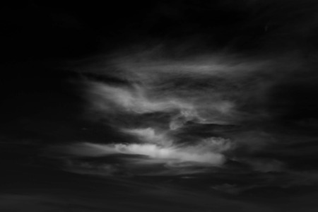 white cloud and black sky textured backgroundの写真素材