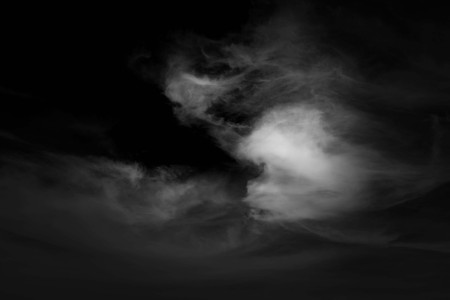 white cloud and black sky textured backgroundの写真素材