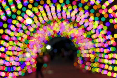 Colorful pink orange red bokeh background of Christmas lights and New year