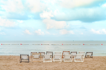 White beach chair  with blue sky and sea viewの写真素材
