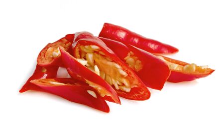 sliced red chili isolated on white backgroundの写真素材