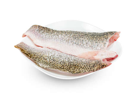 Seabass fish sliced with dish isolated on white