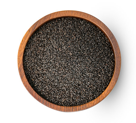 Hairy basil seeds with wooden bowl isolated on white backgroundの写真素材