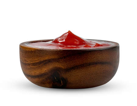 tomato sauce in wooden bowl isolated on white background ,include clipping pathの写真素材