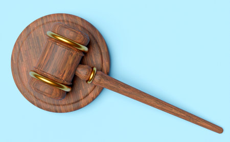 3d wooden judge gavel, hammer auction with stand isolated on blue background. law, justice system symbol concept, 3d render illustration, top view, clipping pathの写真素材