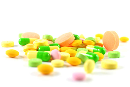 Variety of pills on a white backgroundの写真素材