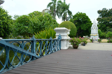 Marble monument tower and wooden bridge at Saranrom Royal Garden Bangkok Thailandの写真素材