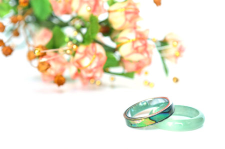 Abalone shell and stone ring on white background