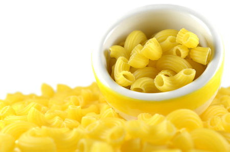 Elbow macaroni on white backgroundの写真素材