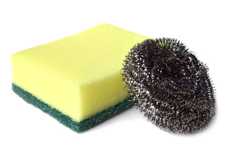 Scrub sponge and steel wool on white background