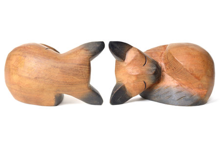 Back view and front view of Thai wooden cat on white backgroundの写真素材