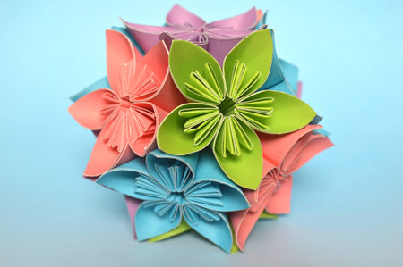 Origami kusudama flower ball on blue backgroundの写真素材