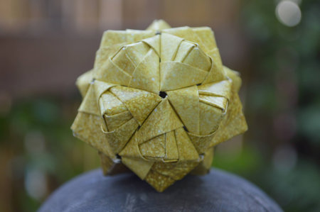 Modular origami, sonobe ball, on natural background
