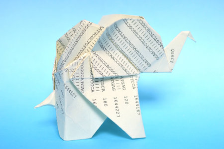 Yellow origami elephant on blue backgroundの写真素材