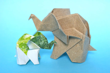 Natural pattern and brown origami elephant on blue backgroundの写真素材