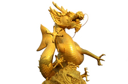 Golden gragon statue on white backgroundの写真素材
