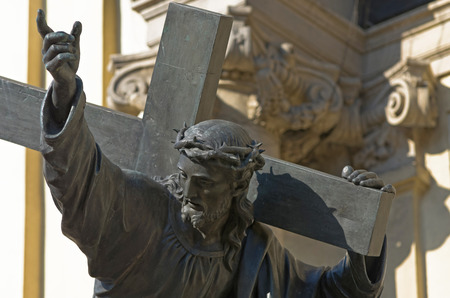 Jesus Christ carrying the cross in front of the Church of the Holly Crossのeditorial素材