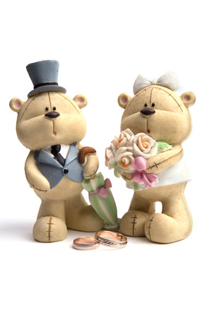 Bears the wedding clothes next to wedding ringsの写真素材