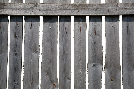 Old grey wooden fenceの写真素材