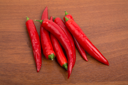Chile peppers on the wooden tableの写真素材
