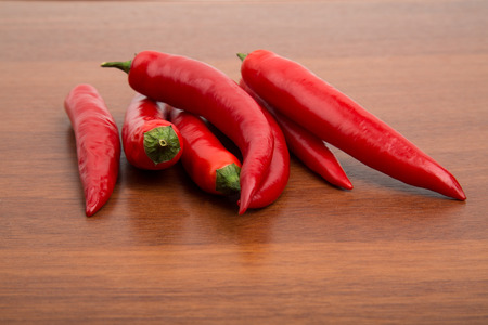 Chile peppers on the wooden tableの写真素材