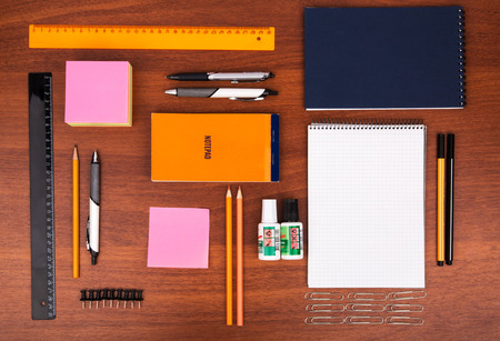 Office desk with glasses pen pencil ruler and other office itemsの写真素材