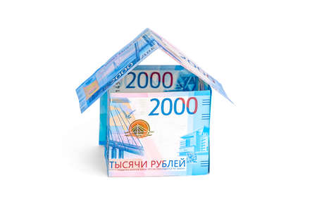 A house made of ruble notes isolated on a white backgroundの写真素材