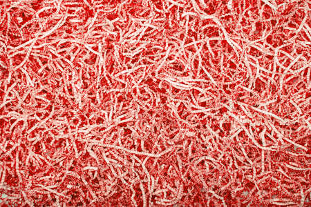 Background of red corrugated cut paperの写真素材